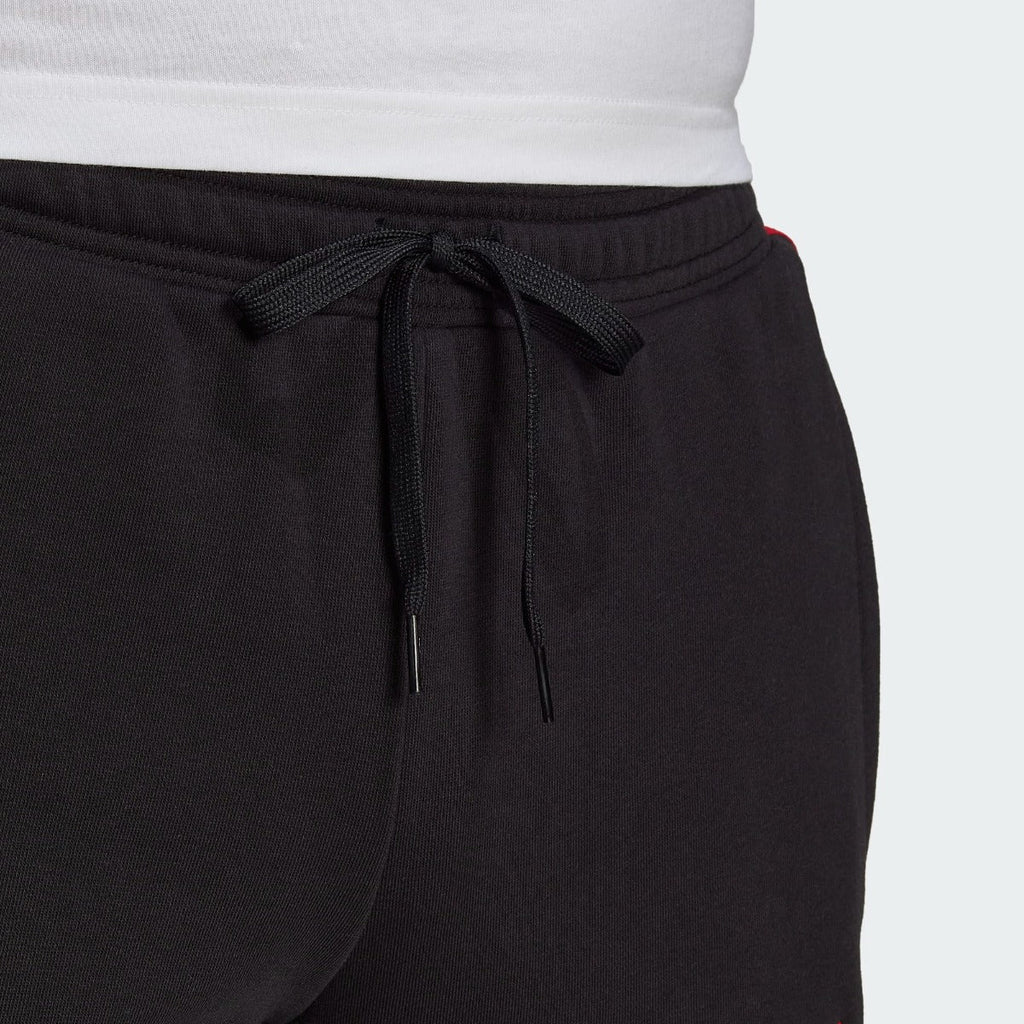 Pantalon d'entrainement Manchester United - Noir/Rouge/Blanc