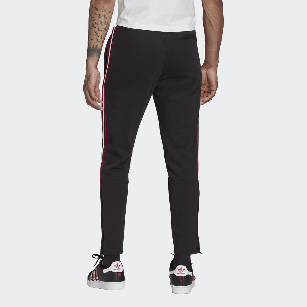 Pantalon d'entrainement Manchester United - Noir/Rouge/Blanc