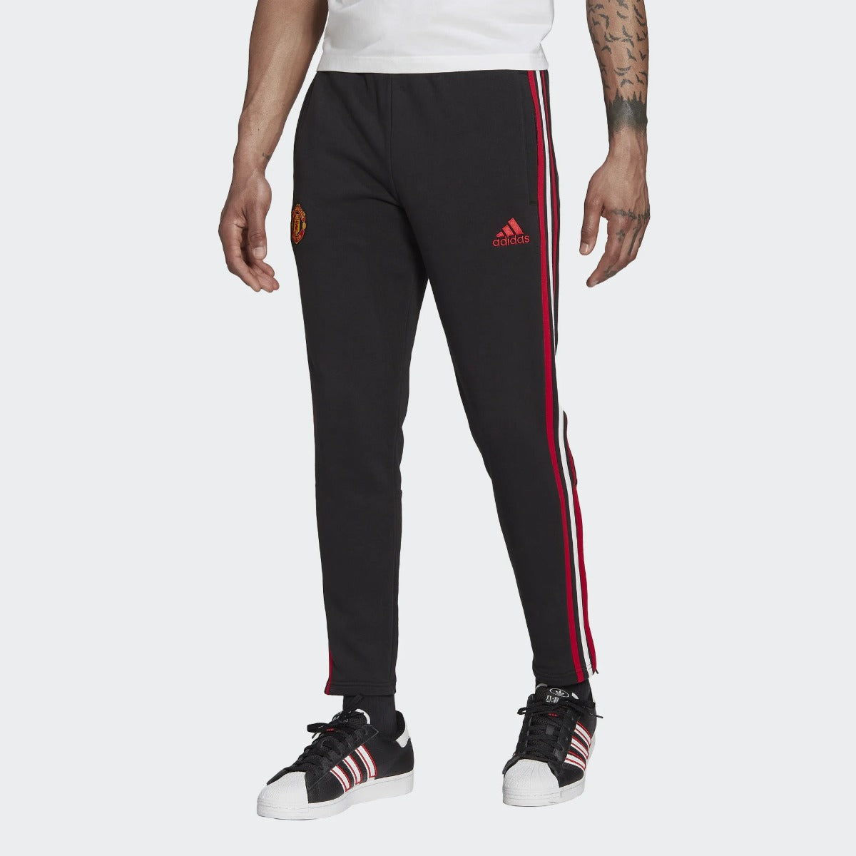 Pantalon d'entrainement Manchester United - Noir/Rouge/Blanc