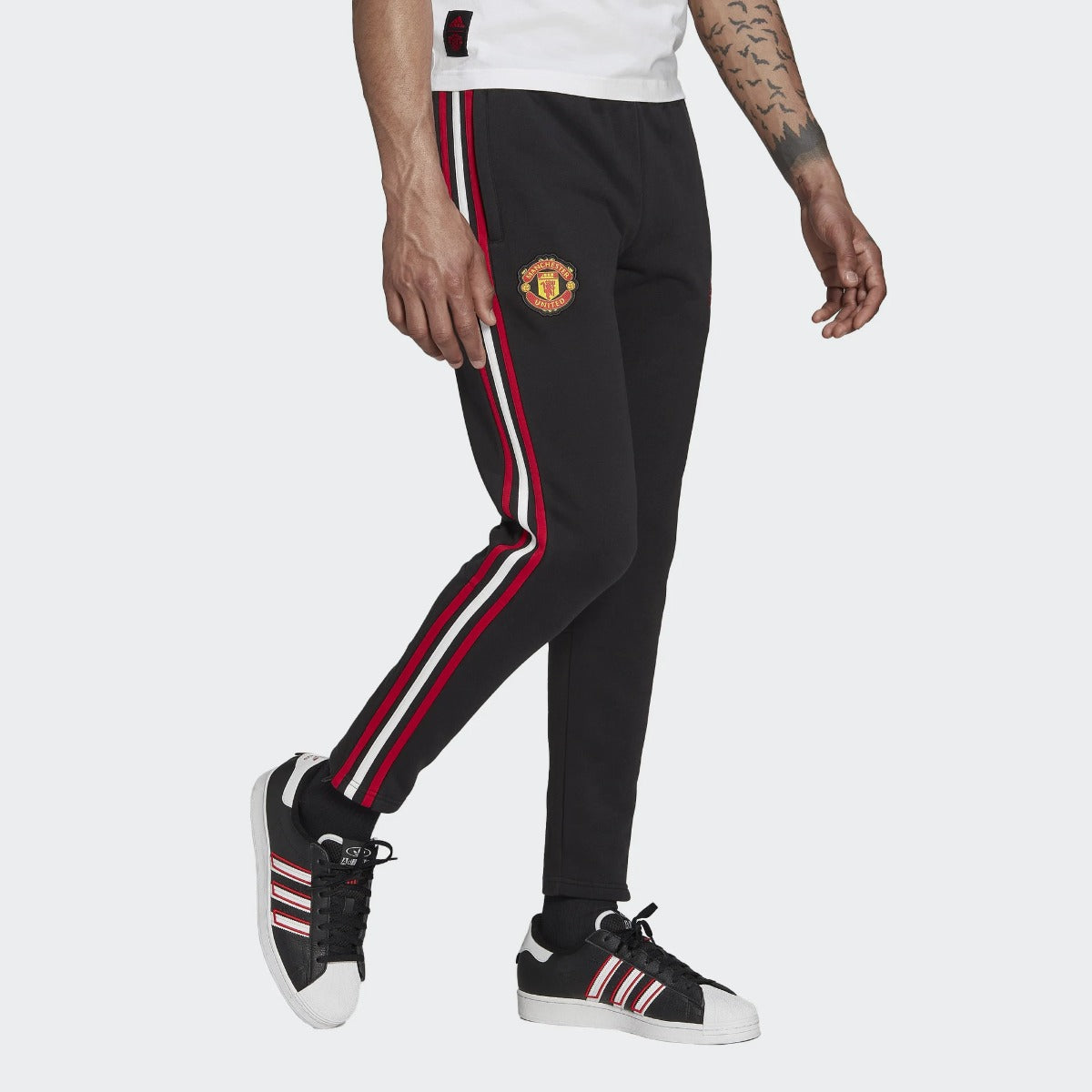 Pantalon d'entrainement Manchester United - Noir/Rouge/Blanc